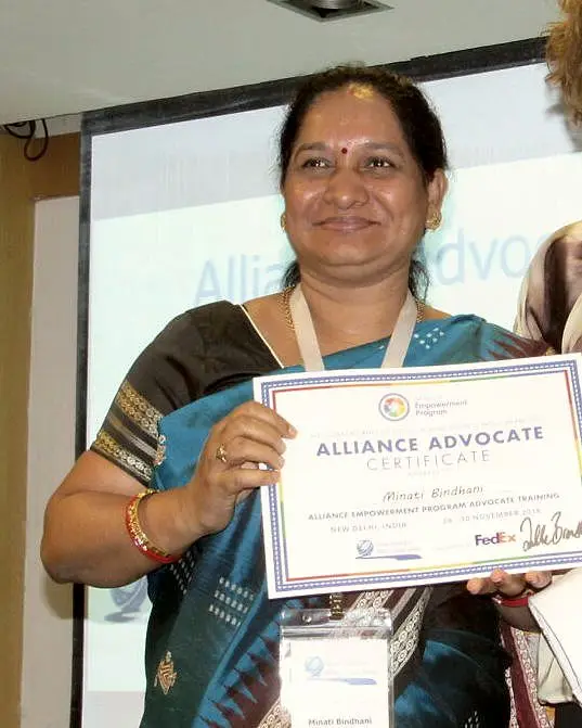 Mrs. Minati Bindhani holds her Alliance Advocate Certificate at a training in New Delhi.